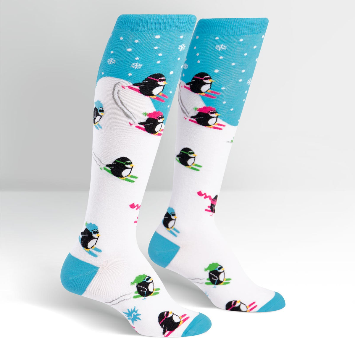 Downhill Penguins knee high socks – flat lay product view