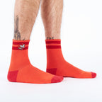 Rad Chicken Quarter Socks featuring a skateboarding chicken design on a bright background